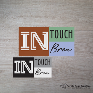 modern style logo with boxes in brown, green, blue and a black, gray, white version of the same logo on wooden background